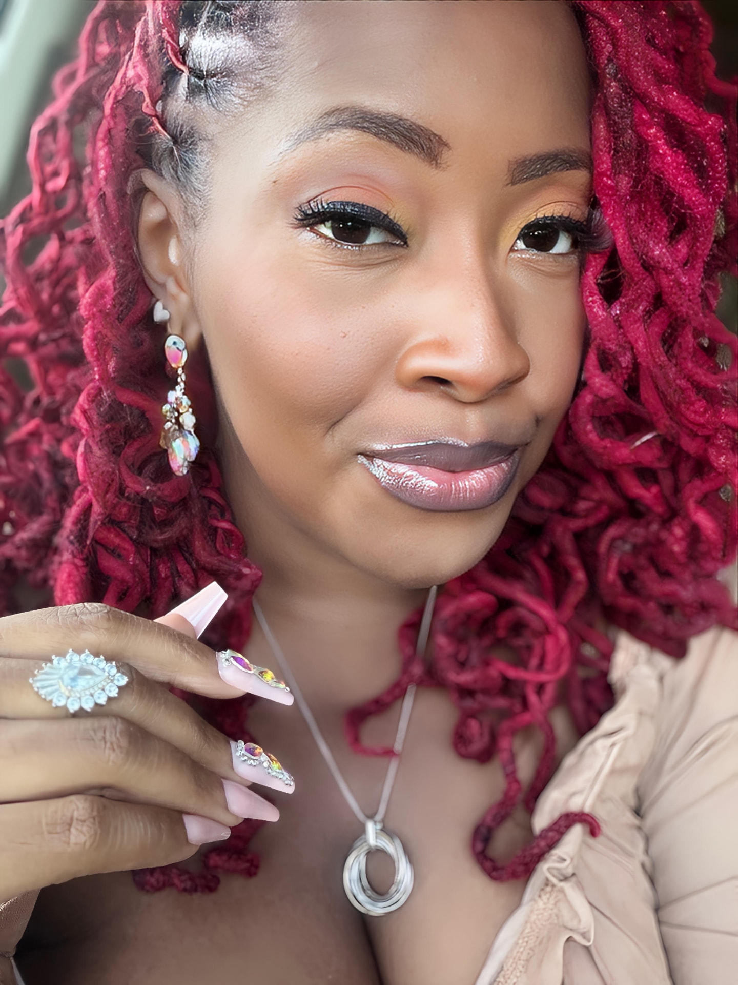 R. Nicole wearing Full Spectrum earrings and the Married to the Money ring
