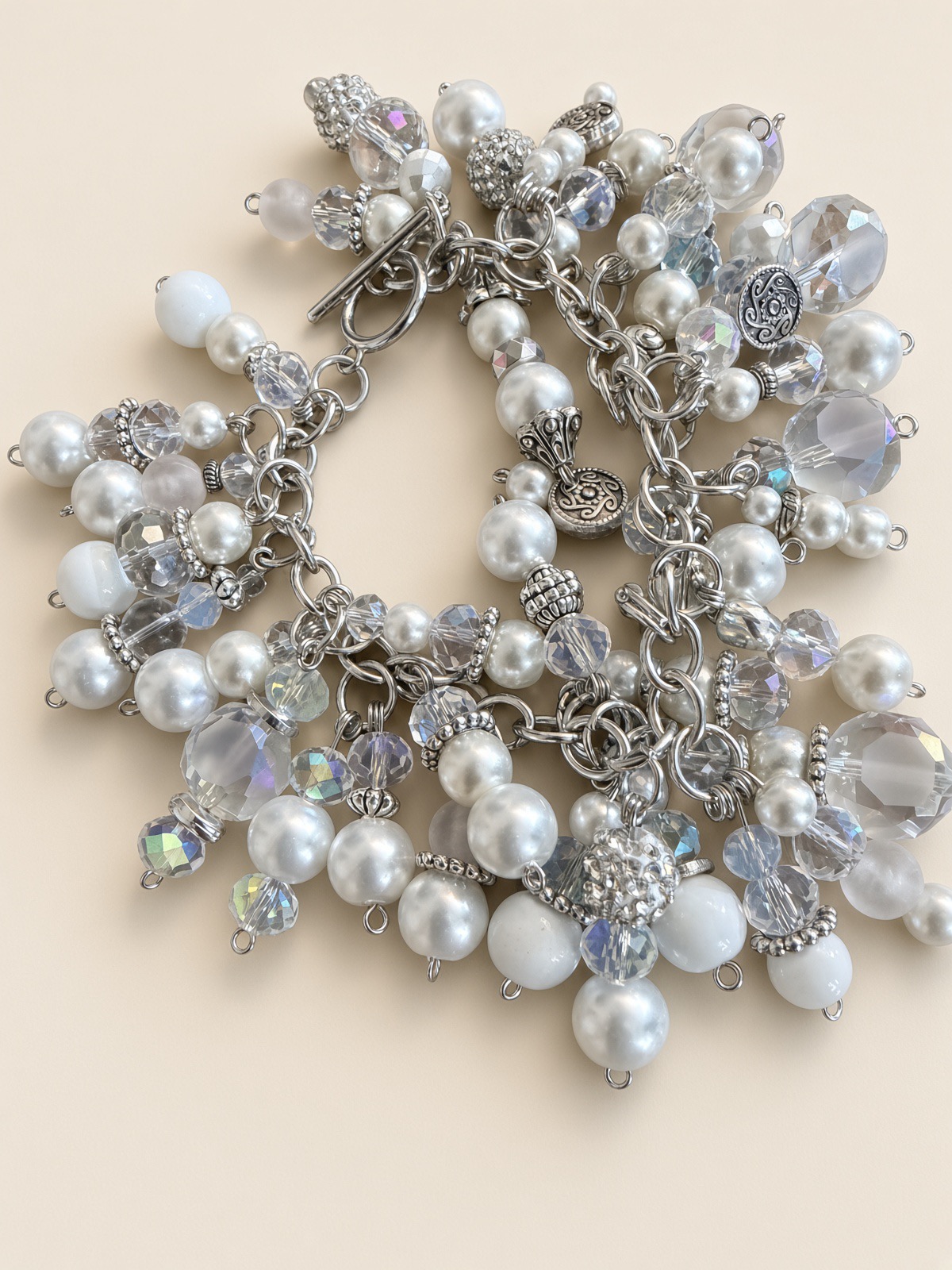 Macro detail of a silver Clickety-Clack charm bracelet