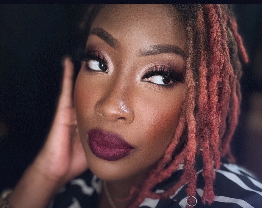 R. Nicole, founder of stillHER — close-up editorial portrait